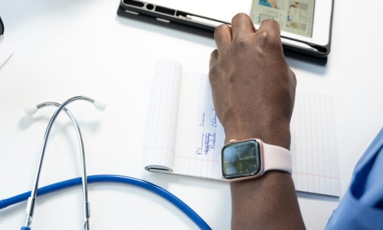 a hand holding a smart watch